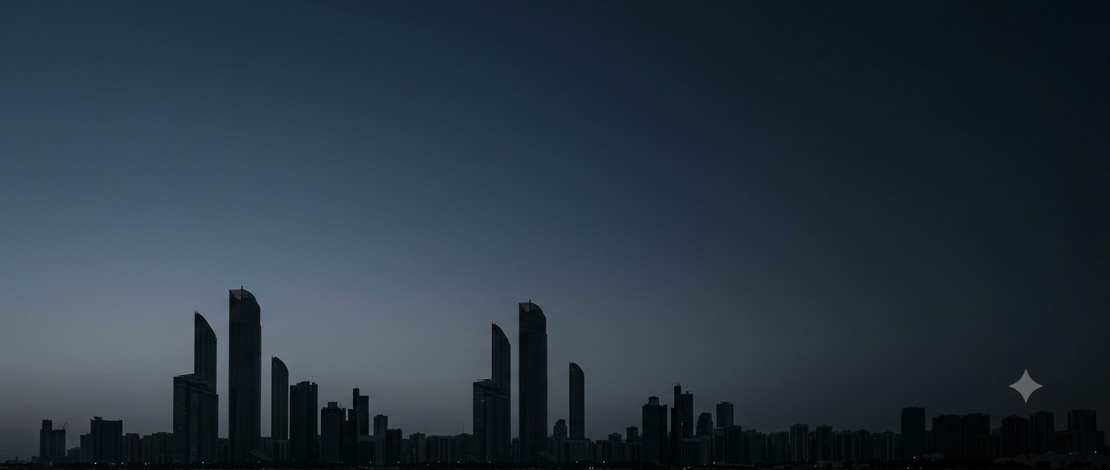 Abu Dhabi skyline at dusk, towers in silhouette against a darkening sky